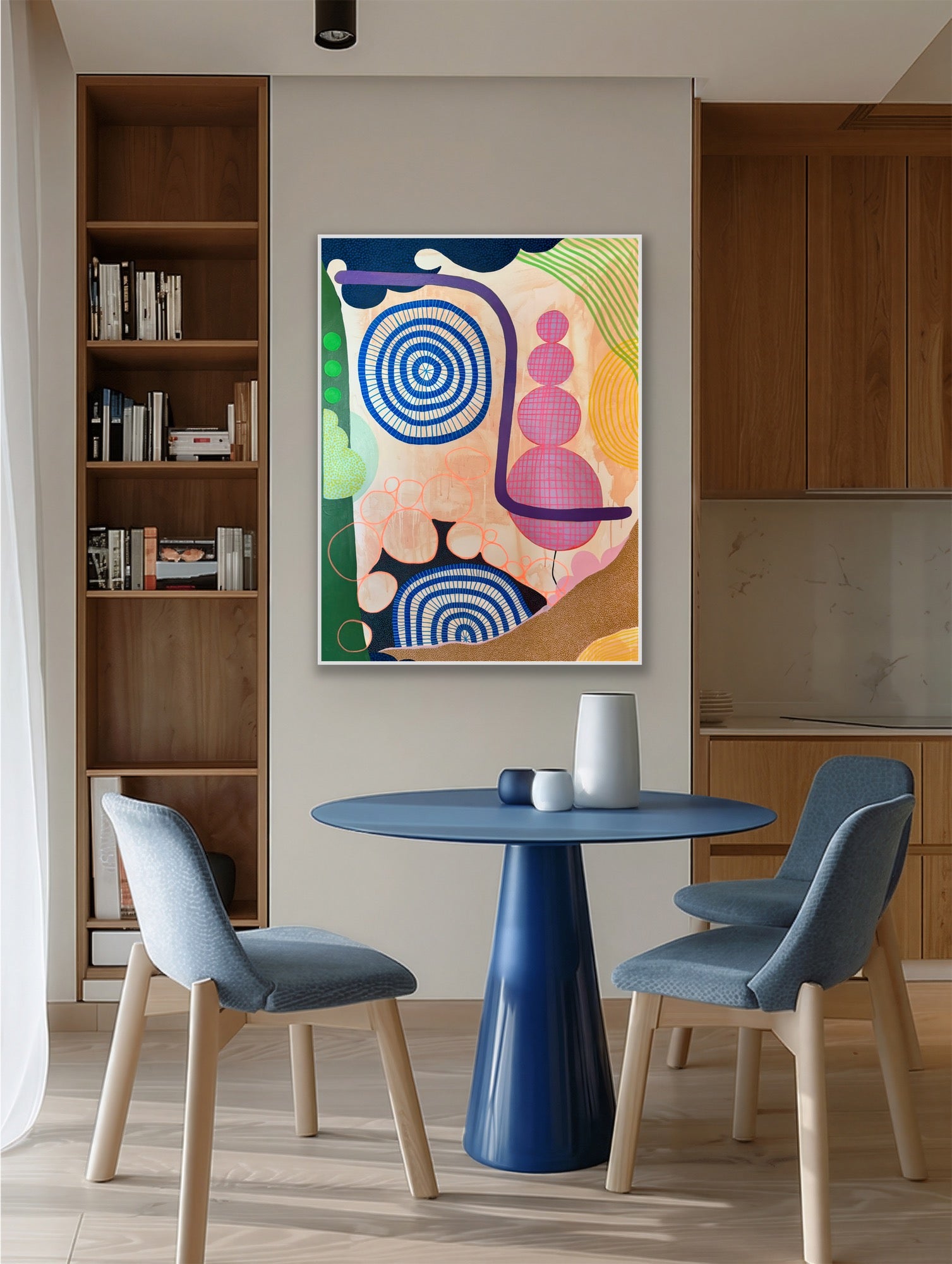 Modern interior with a blue table and chairs, a colorful abstract painting on the wall, and wooden shelves.