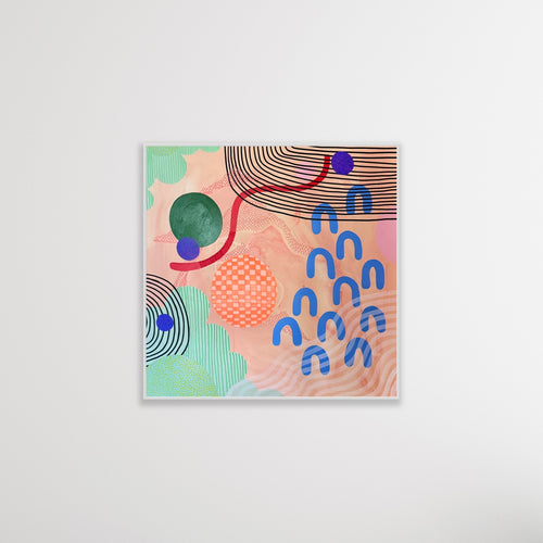 Abstract art print with colorful shapes on a white wall