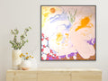 Abstract painting with colorful swirls on a wall above a wooden shelf with decorative vases.